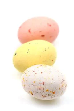 Speckled multicolored chocolate EASTER eggs in row Stock Photos