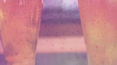 Speckled overlay appearing, camera revealing two pint glasses filling, foaming, Stock Footage 321889805