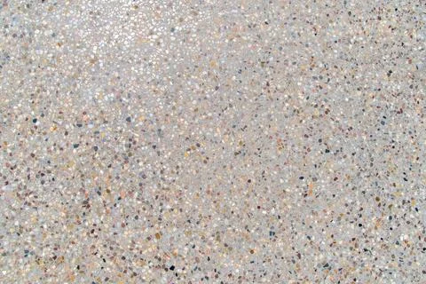 Speckled terrazzo surface with multicolored pebbles pattern Stock Photos