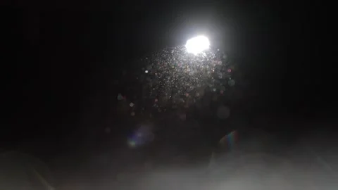 Specks of dust dancing in a ray of light 库存影片 258835843