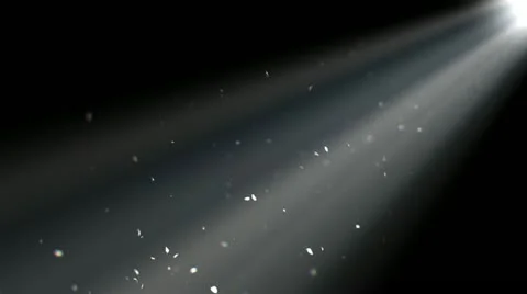 Specks of dust floating a beam of light. Stock Footage