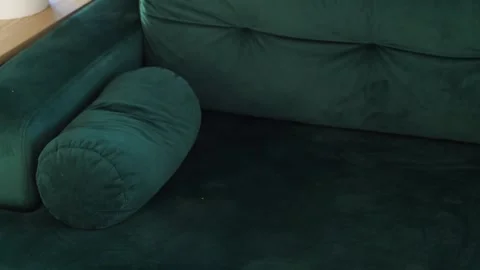 Specks of dust flying in front of an empty couch, dust particles at home Stock Footage 291669213