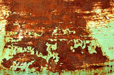Specks of rust on old green painted metal texture pattern background. Stock Photos