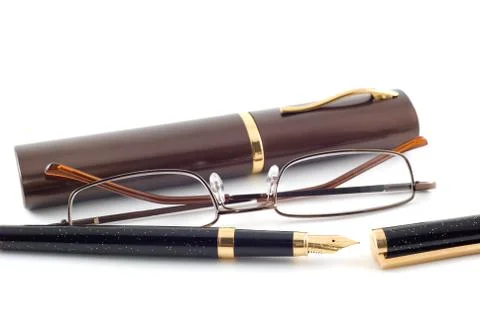 Spectacles and pen Stock Photos