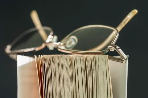 Spectacles on a Book Stock Photos