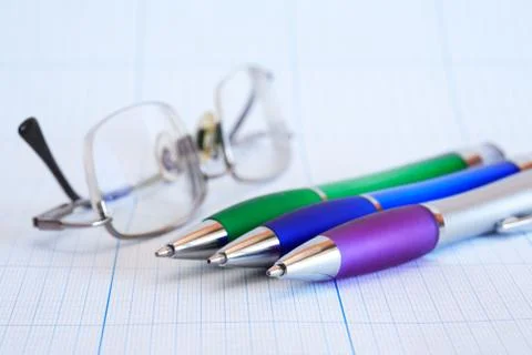 Spectacles near pen Stock-Fotos