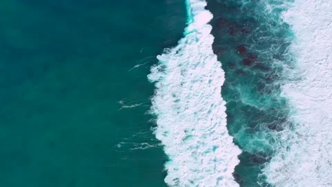 Spectacular aerial straight down powerful ocean waves rolling tropical shoreline Stock Footage 342414763