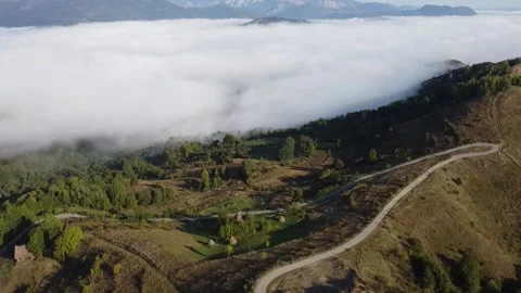 Spectacular Aerial view of Clouds in Mountains Stock Footage 163913784