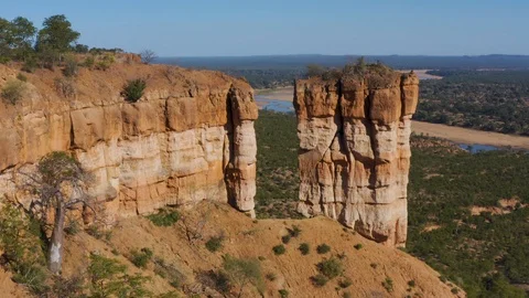 Spectacular aerial view flying through a gap of the beautiful red sandstone Stock Footage 112807876