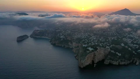 Spectacular aerial view of the sunset behind Cape La Nao. Stock Footage 143140845