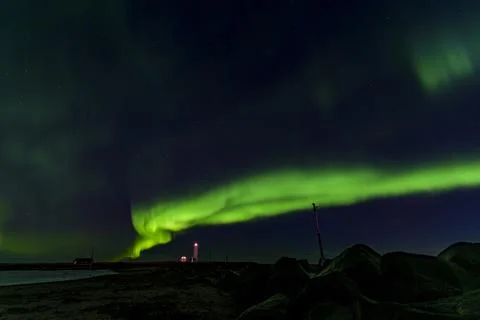 Spectacular Aurora Borealis Frames Glowing Icelandic Lighthouse Stock Photos