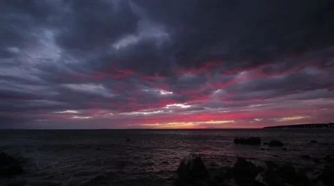 Spectacular Beautiful Red Luminous Clouds Over Sea Sunset Seascape Rocky Beach 1 Video stock 51239006