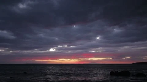 Spectacular Beautiful Red Luminous Clouds Over Sea Sunset Seascape Rocky Beach 2 Stock Footage 51239339