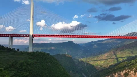 Spectacular Beipanjiang Bridge Spanning a Deep Mountain Valley Guizhou China Stock Footage 346588919