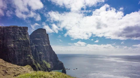 Spectacular cliff view with clouds and blue sky, Faroe Islands, 4K time lapse Stock Footage 65306315