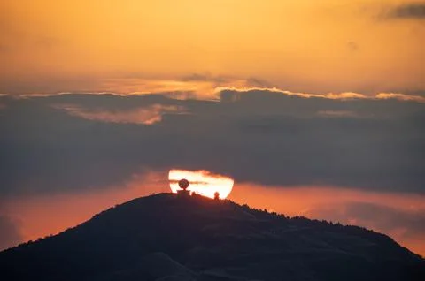 Spectacular close-up of the sunset process. Orange flaming sky. Stock Photos
