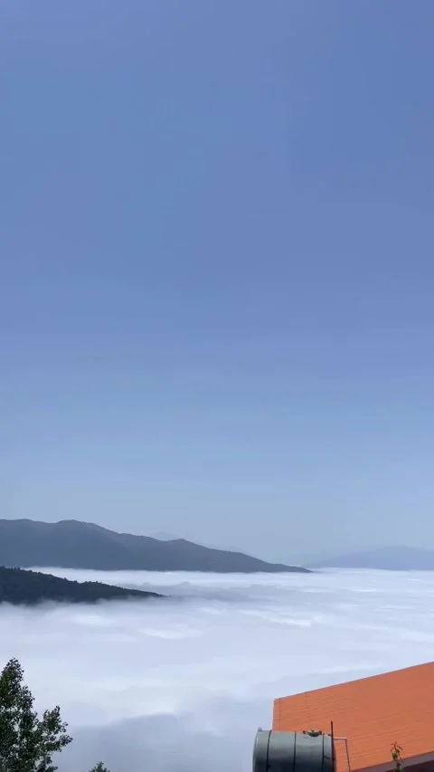 Spectacular Cloud Inversion Over Deep Mountain Valley Stock-Footage 339880670