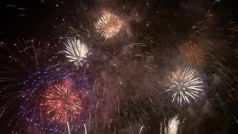 Spectacular, colorful fireworks display, exploding against a black night sky. Stock Footage 95033768
