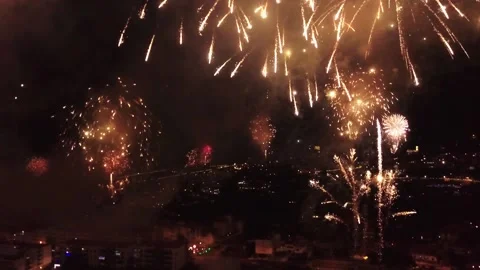 Spectacular colorful  golden fireworks exploding at night over Madeira in Stock Footage 146346953