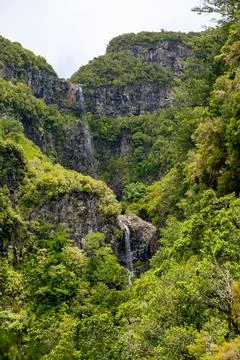 Spectacular double waterfall falling through jungle forest. Stock Photos