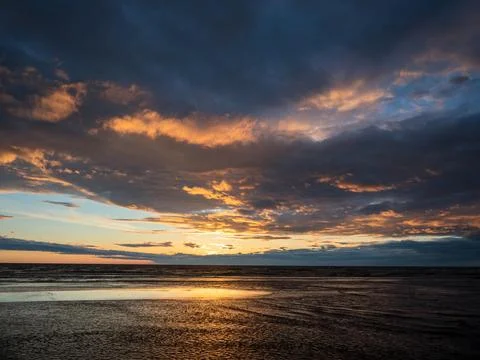 Spectacular dramatic sunset over the sea Stock Photos