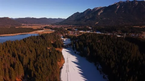 Spectacular drone view of ice skaters on Grubsee lake, Kruen. A pristine winter Stock Footage 325861150