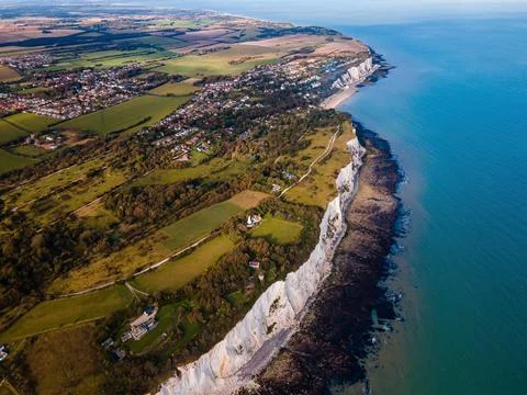 Spectacular Drone View of White Cliffs Embracing the Turquoise Waters of th.. Stock Photos
