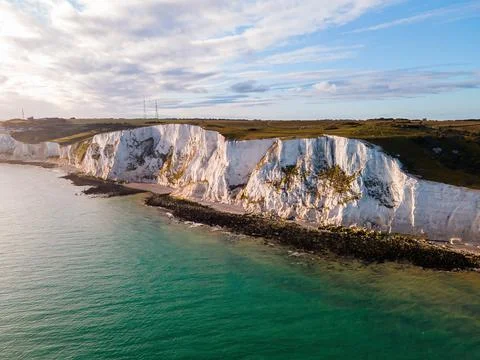 Spectacular Drone View of White Cliffs Embracing the Turquoise Waters of th.. Stock Photos