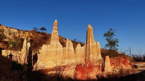 Spectacular Earth Pillars Under Clear Blue Sky in Wumao Earth Forest Yuanmou 動画素材 346737726
