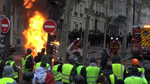 Spectacular emergency situation with firemen, cops and rioters in Europe Stock Footage 103234323