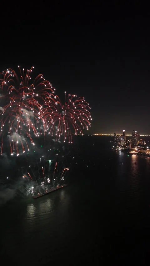 Spectacular Fireworks Celebration Exploding Over the City Skyline of Pattaya, Stock Footage 335844142