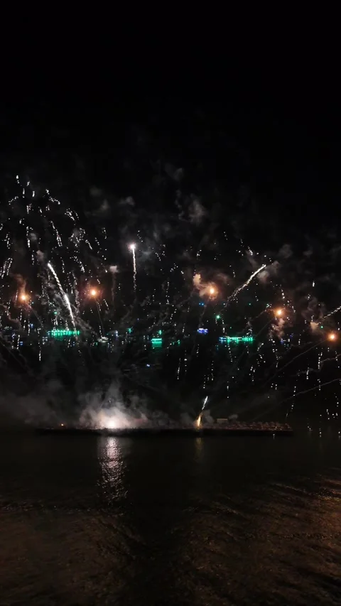 Spectacular Fireworks Display Exploding Over Water at Night in Pattaya, Thailand Stock Footage 335843435
