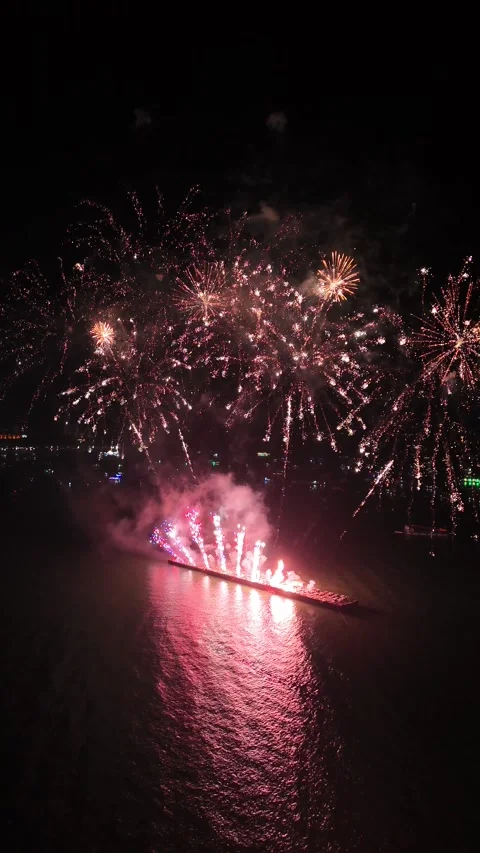 Spectacular Fireworks Display Exploding Over the Sea at Night in Pattaya, Stock Footage 335843496