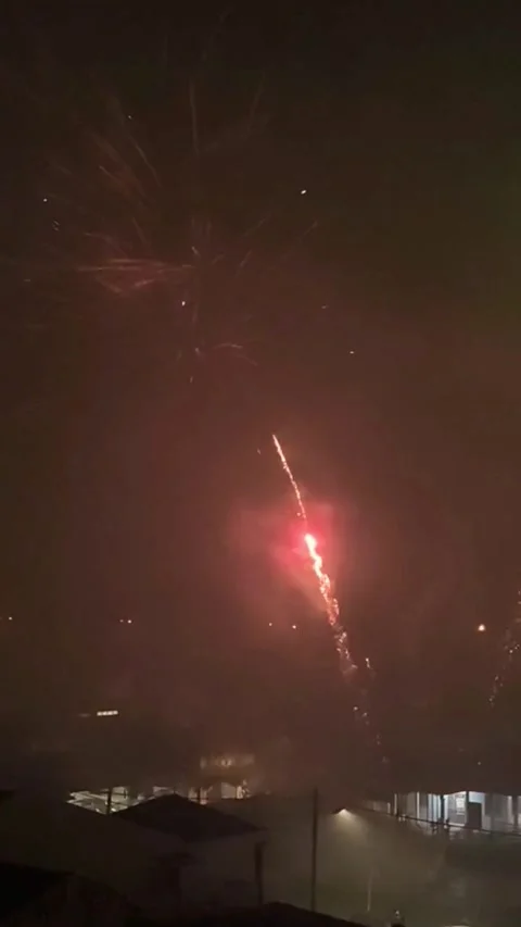 Spectacular Fireworks Display Lighting Up the Night Sky with Vivid Colors Stock Footage 319935964