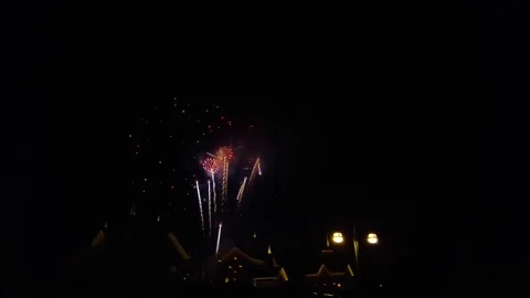 Spectacular Fireworks Display Lights up the Night Sky Above Historic Building Stock Footage 325616954