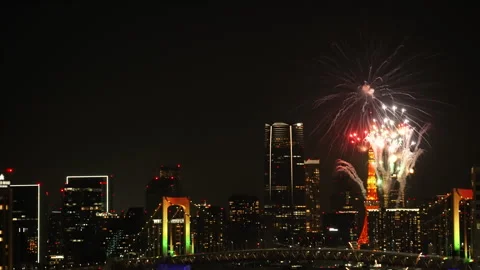 Spectacular fireworks display over Tokyo Tower and Rainbow Bridge at night. Stock Footage 346247123