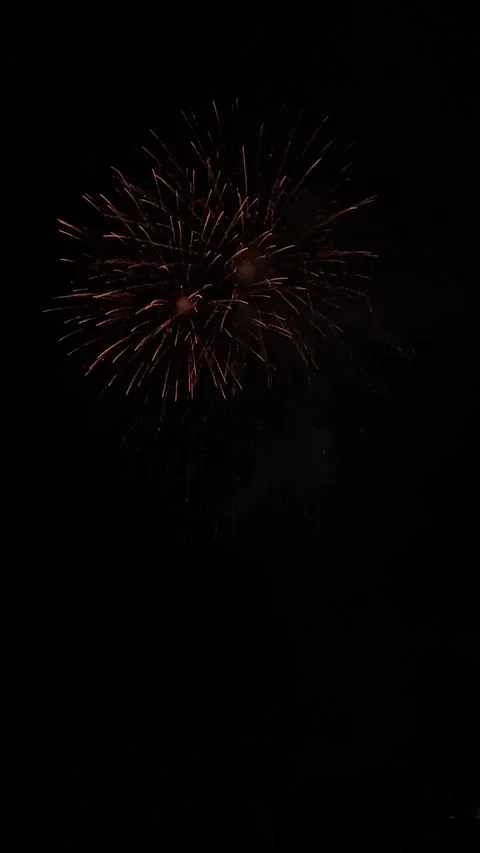 Spectacular fireworks exploding in the night sky over Olot, Spain Stockbeeldmateriaal 345048055