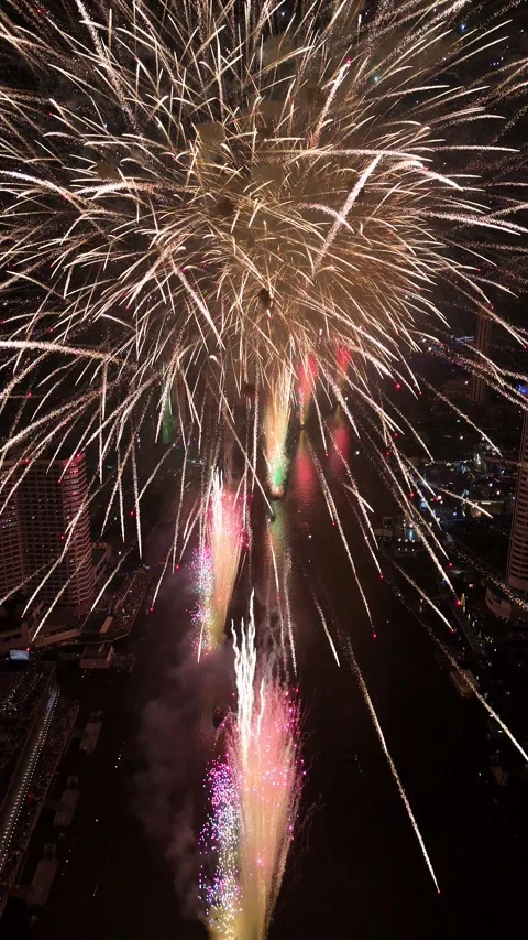 Spectacular Fireworks Exploding Over a City River in Bangkok, Thailand Stock Footage 335847968