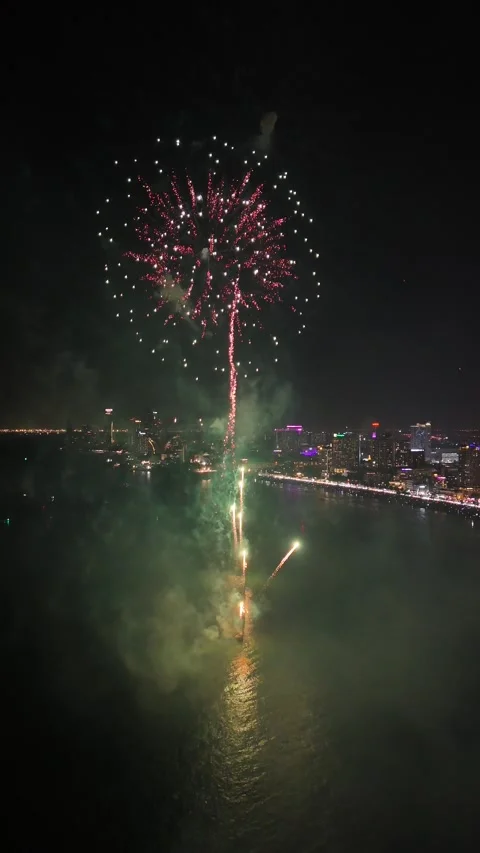 Spectacular Fireworks Exploding Over Night Cityscape in Pattaya, Thailand Stock Footage 335842657