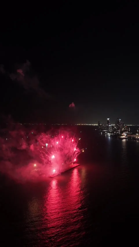 Spectacular Fireworks Exploding Over Water at Night in Pattaya, Thailand Stock Footage 335843918