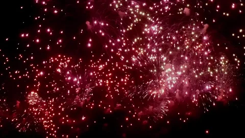 Spectacular Fireworks Explosion Illuminating the Night Sky in Vibrant Colors Stock Footage 321015890