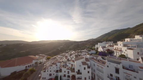 Spectacular flight of an FPV drone over the roofs of a typical Andalusian villag Stock Footage 146012603