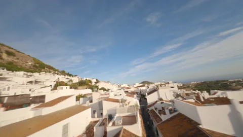 Spectacular flight of an FPV drone over the roofs of a typical Andalusian villag Stock Footage 146014005