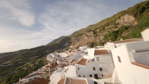 Spectacular flight of an FPV drone over the roofs of a typical Andalusian villag Stock Footage 146190415