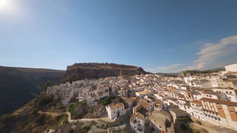 Spectacular flight of an FPV drone over the roofs of a typical Andalusian villag Stock Footage 148564938