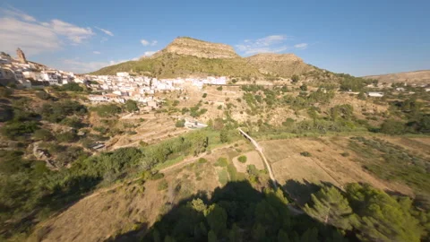Spectacular flight of an FPV drone over the roofs of a typical Andalusian villag Stock Footage 148570136