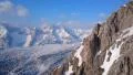 Spectacular horizontal panorama of winter mountains. Snowy hills on a sunny day 4k or 4k+ Resolution