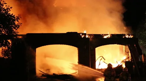 Spectacular house fire, firemen use hose Stock Footage 53795447