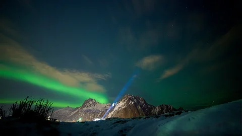 Spectacular northern light distant mountain scenery blue light up in sky Stock Footage 86307991