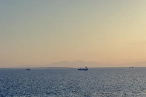 Spectacular panorama view of sun setting into Thermaic gulf. Stock Photos